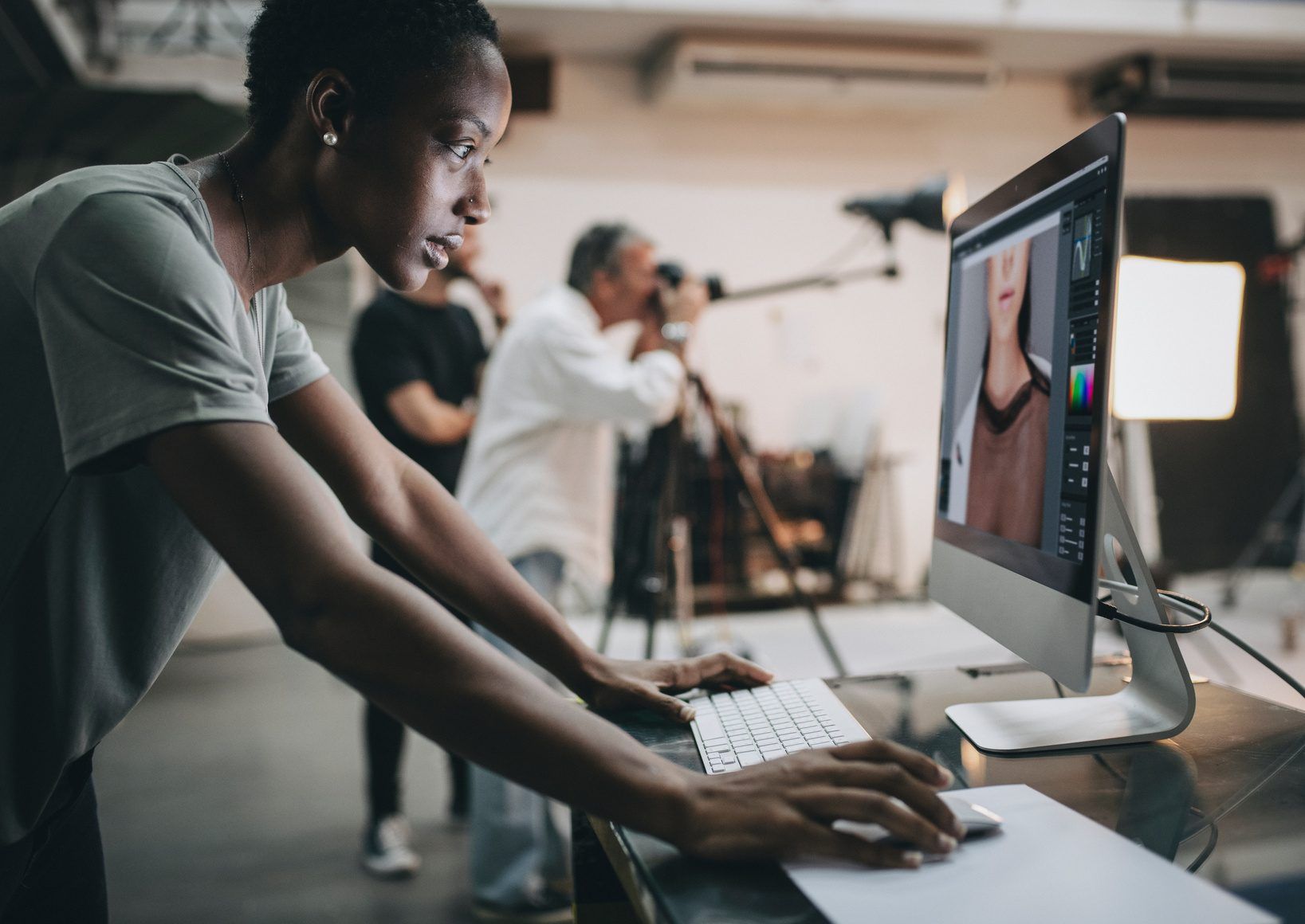 A creative director reviewing work on set