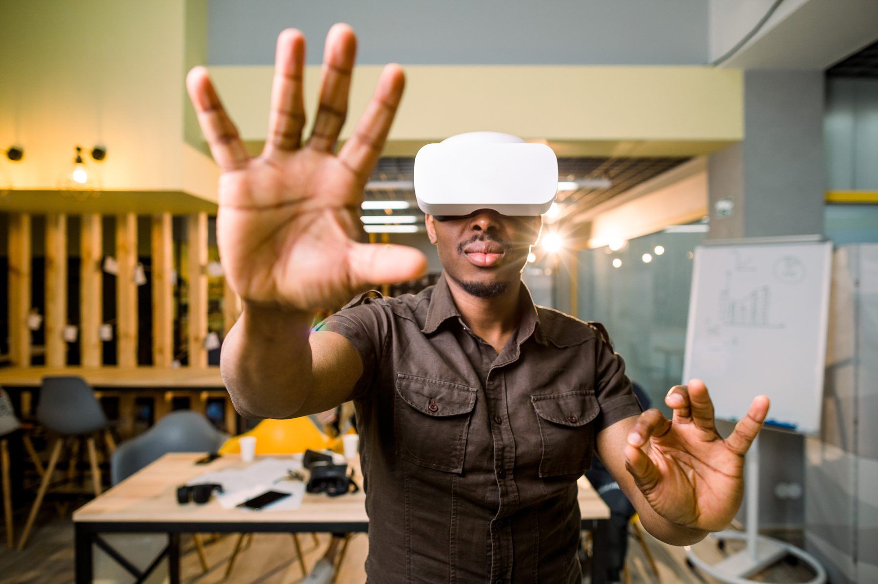 A smiling man exploring virtual reality