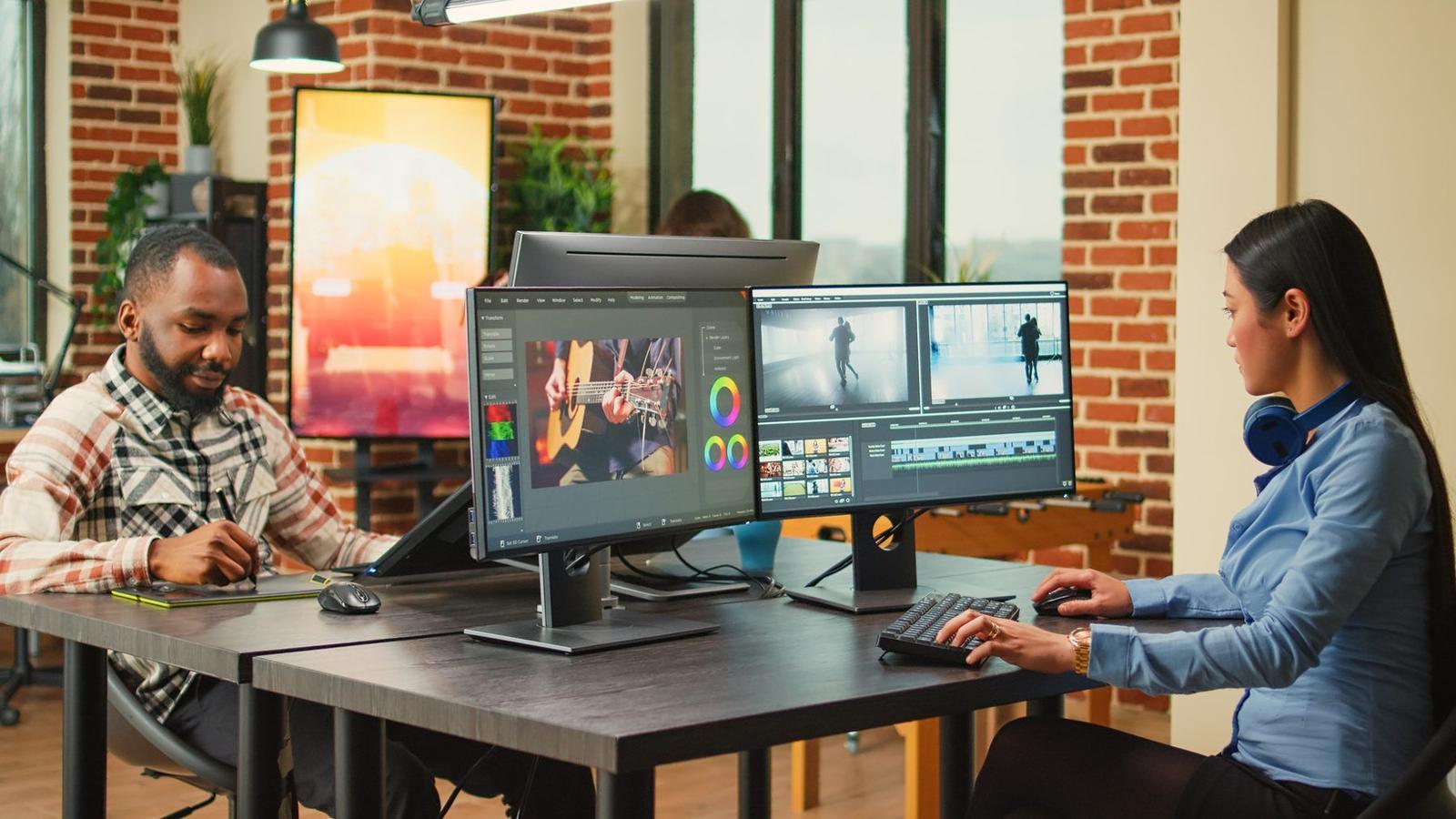 A designer producing digital assets at a large screen