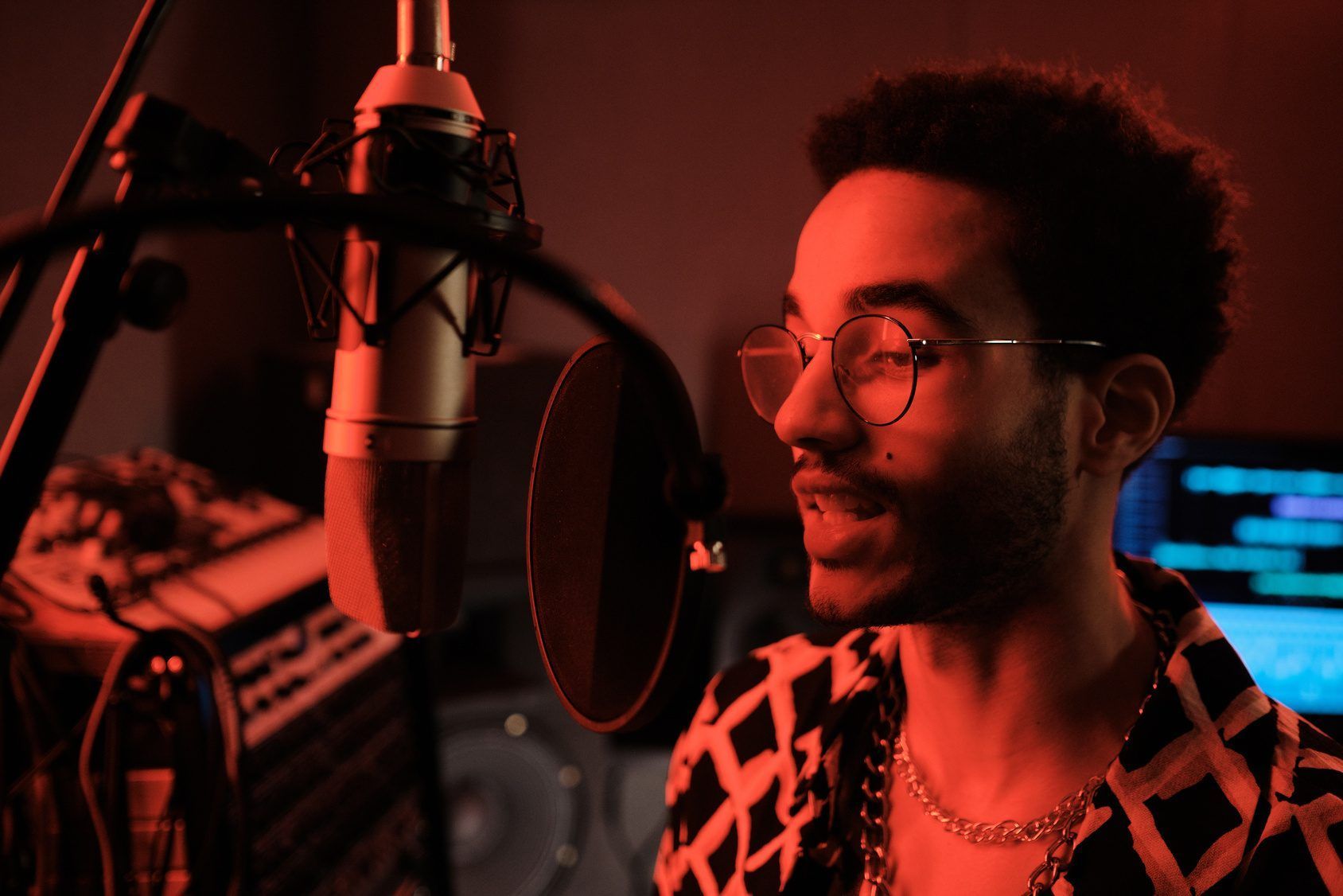 A singer recording vocals in a studio