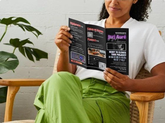 A woman reading a printed brochure