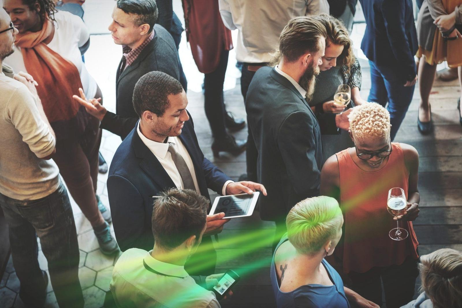 Two professionals shaking hands at a networking event